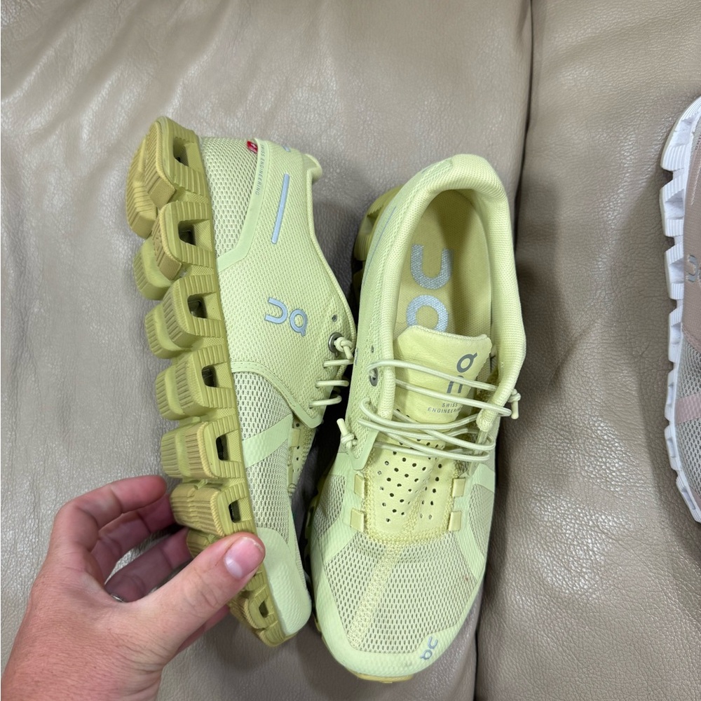 On Running Light Green Athletic Shoes with Mesh Upper and Unique Sole